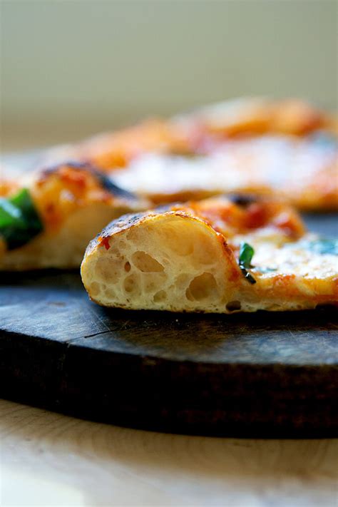 Transfer the sheet pan to the oven and bake for 25 to 30 minutes, until the underside is golden and crisp. . Alexandra cooks pizza dough